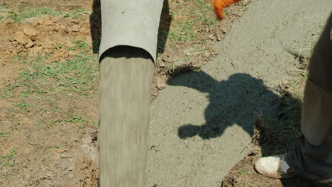 Concrete-Flows-Through-The-Pipe-Into-The-Foundation-Of-The-Basement-Construction-Of-Cottages-Concept