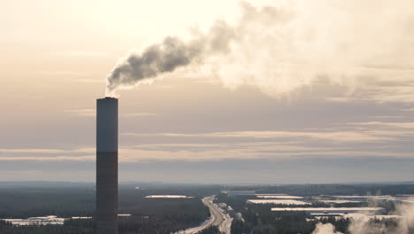 Air-pollution-by-smokestack-emitting-harmful-greenhouse-gases,-sunset-aerial