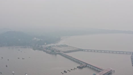 Reveal-drone-shot-of-full-mandwa-jetty-on-a-hazy-day