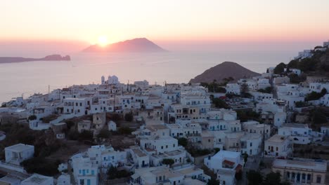 plaka milos town overlloking the gulf during dazzling sunset landscape, greek island