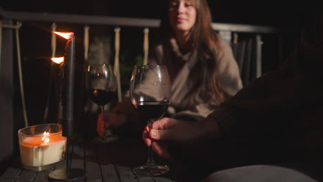romantic evening on a patio with wine and candles