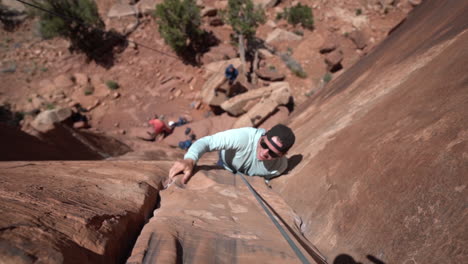 top down view of climber on steep vertical cliff