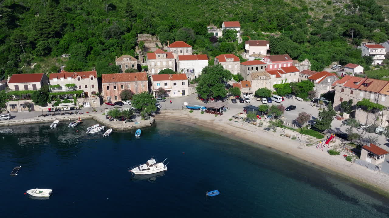 Boats Floating In The Sea By Trstenik Village in Peljesac Peninsula, Croatia. - aerial shot