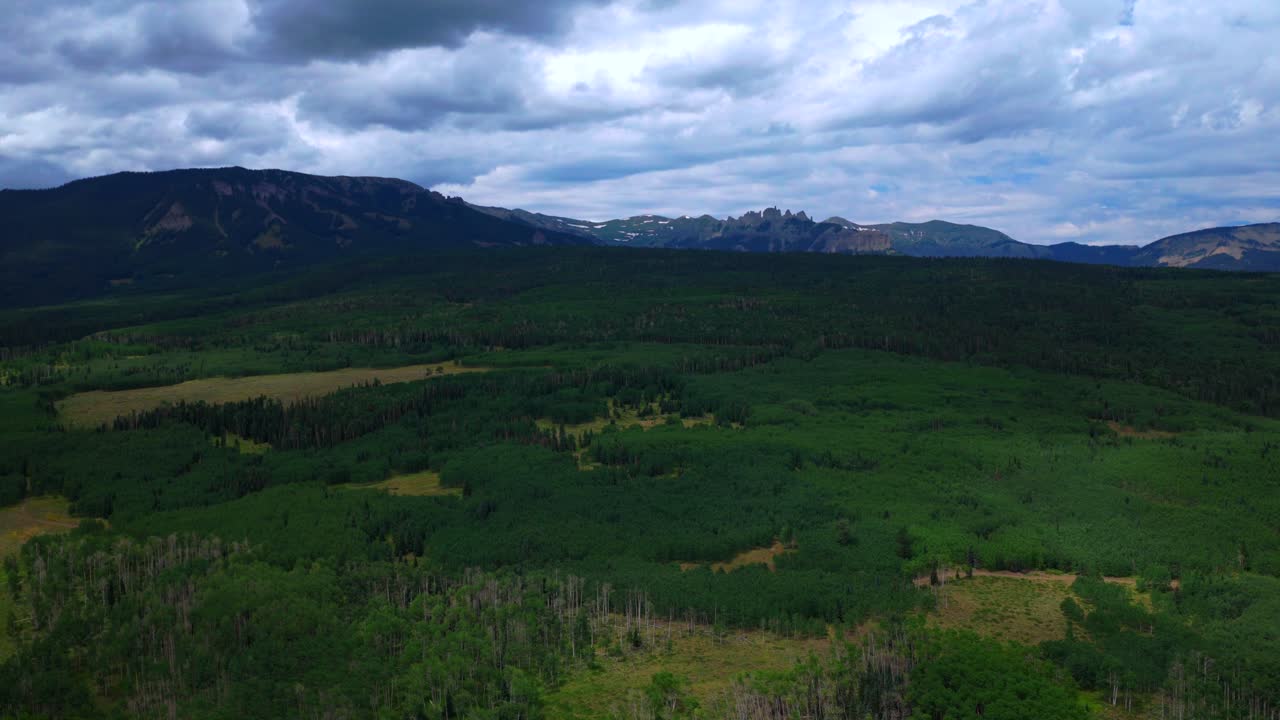 Mill Castle rock formation hidden gem Ohio Pass aerial drone Colorado Rocky Mountains spring summer morning cloudy Aspen Tree Forest groves Swampy Kebler Pass Gunnison National Forest circle left