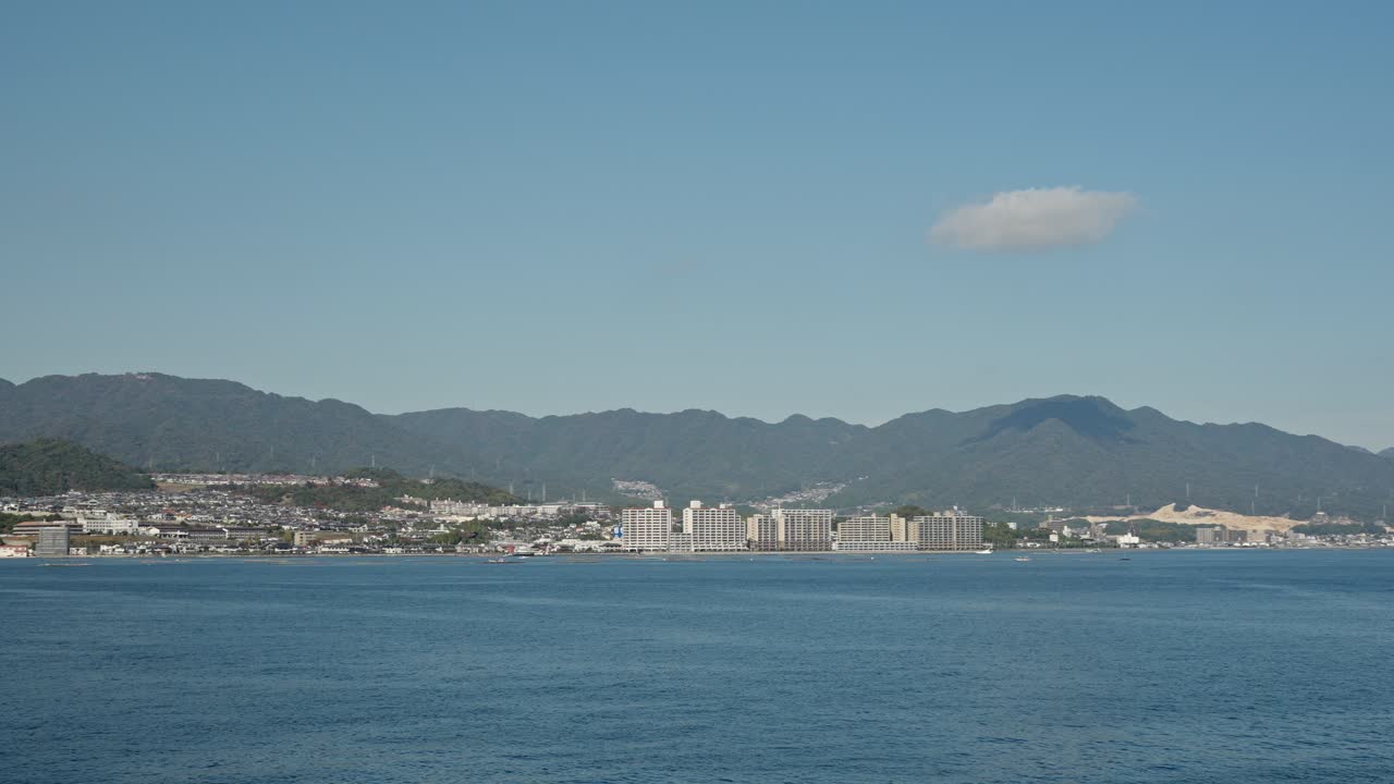 A serene vista of the area of Itsukushima highlights the natural beauty and historic charm of this Hiroshima treasure.