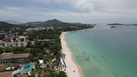 Aerial-shot-of-beach-and-coastal-city-