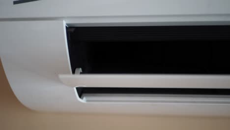 close-up of a white wall-mounted air conditioner unit