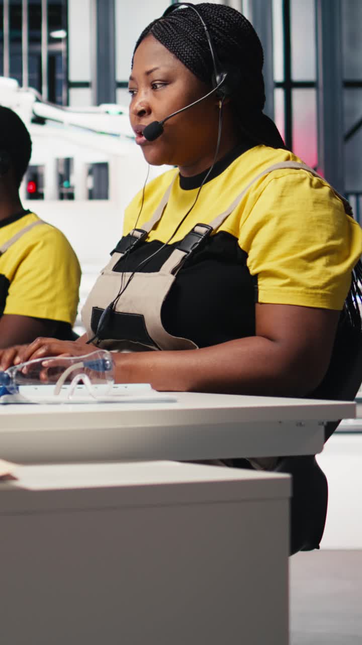 Vertical Video African American engineer offers service from solar panel call center