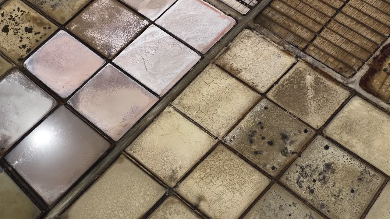 Salinas De Janubio volcanic salt flats aerial view circling over the Lanzarote lagoon grid formation