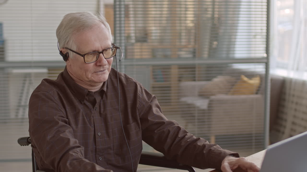 Optimistic Senior Man Working in Call Center