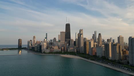 chicago usa at sunset, aerial view of cityscape skyline and central towers from michigan lake, drone shot