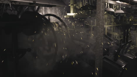 industrial machinery operates in a dimly lit factory setting with sparks flying