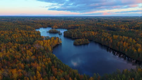 a lake in the middle of an endless wilderness forest in southern finland