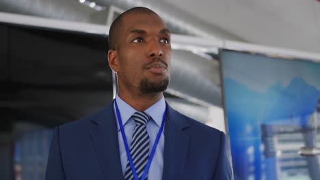 male speaker addressing the audience at a business conference