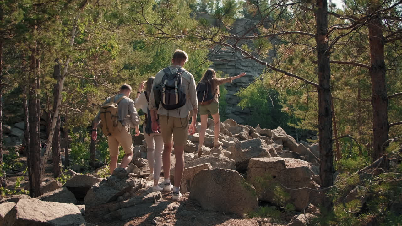 Young People Hiking on Rocky Terrain