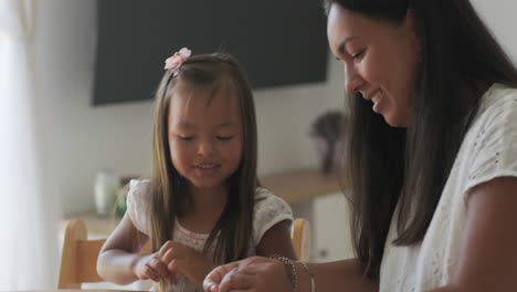 mother and daughter crafting together