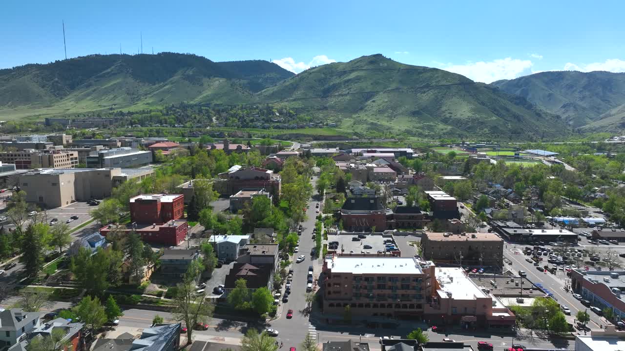 Aerial Drone Slow Rise Above town of Golden Colorado On a summer Day with mountains in the background.