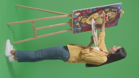 woman painting a portrait