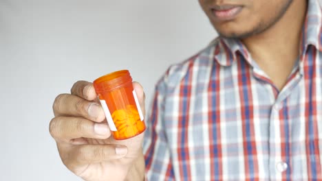 person holding a pill container