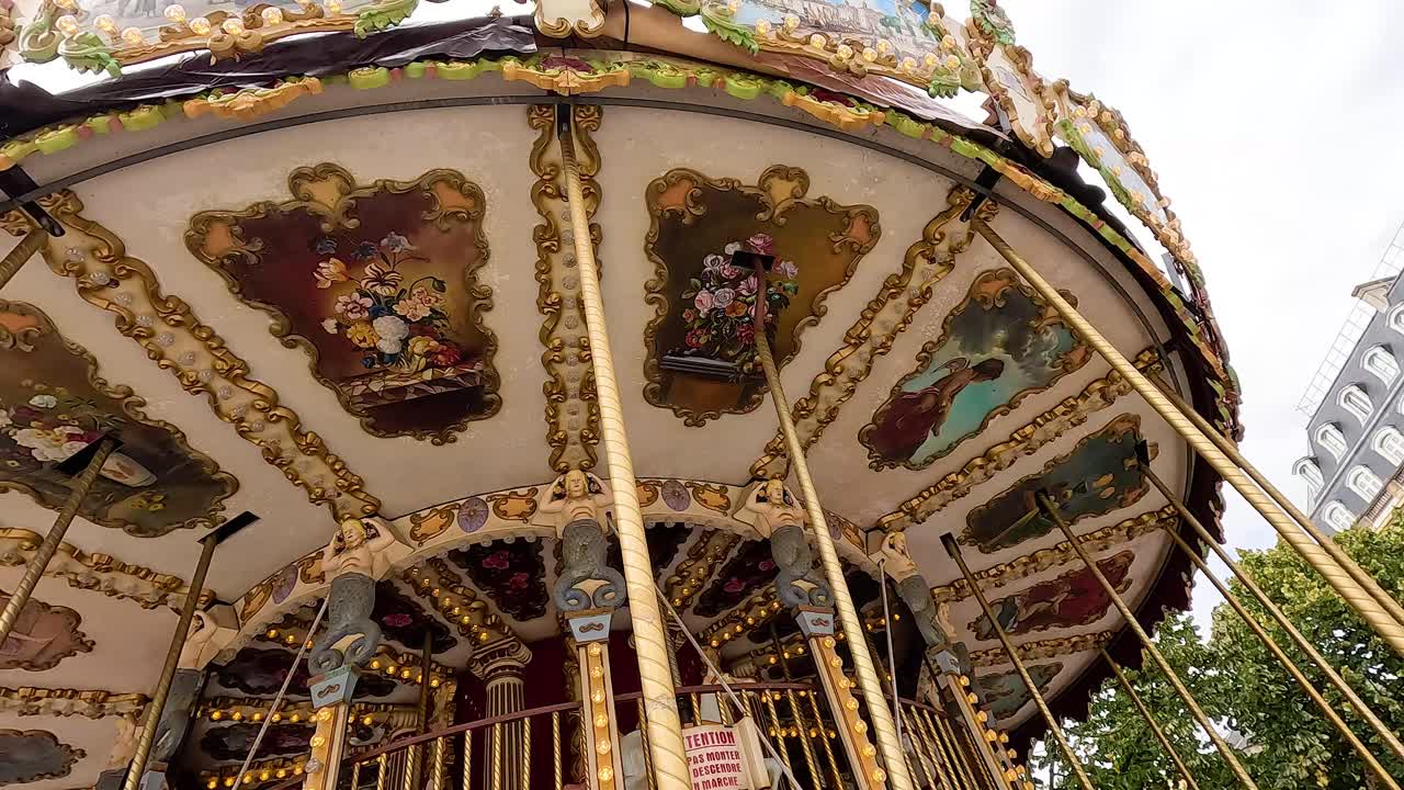 Colorful carousel spinning in Bordeaux, France
