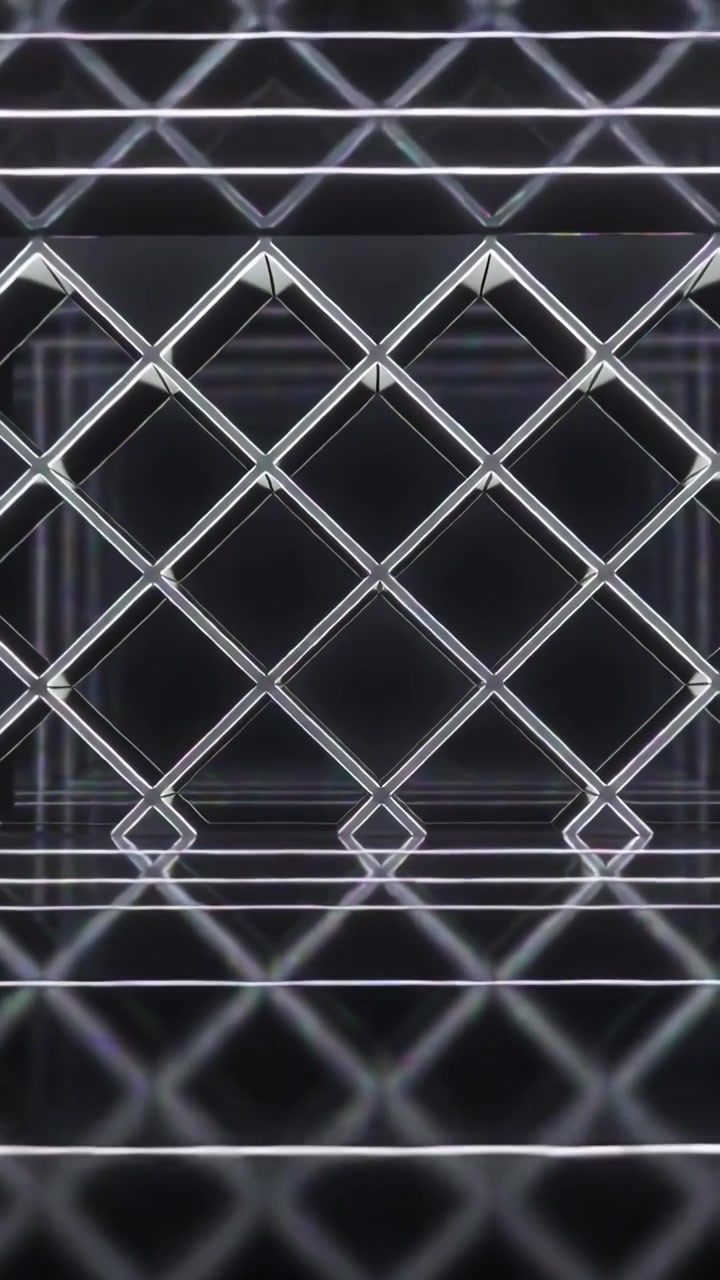 Vertical video: Pulling back camera showing lit diamond lattice in dark hall, highlighting depth