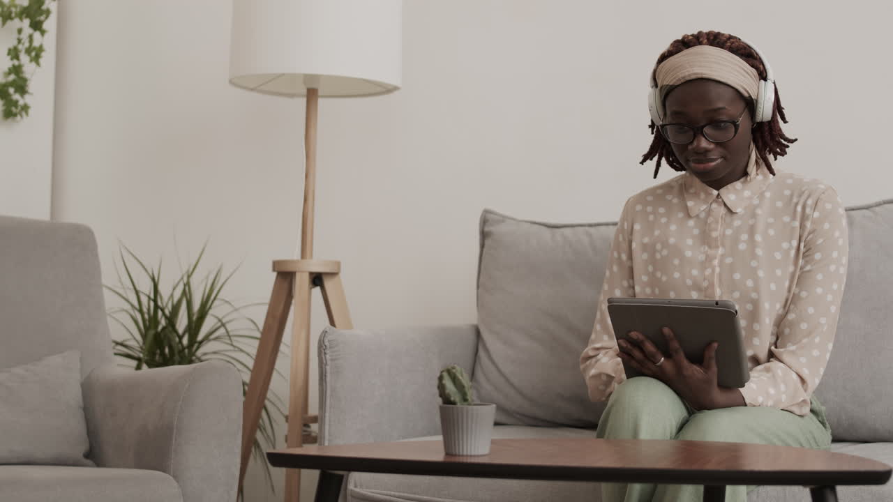 Young African Woman Listening to Music