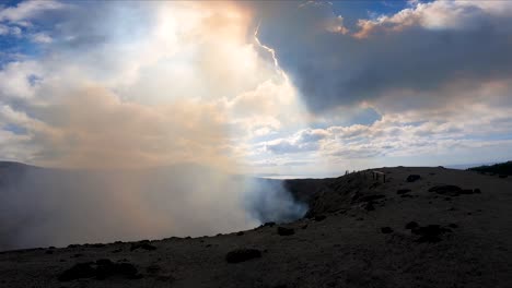 gopro action cam pov top of volcano mountain hill crest sky and smoke dust clouds travel tourism holiday spot sightseeing vanuatu tanna island south pacific hd