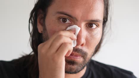 skincare, face cleaning, skin care, latino man wiping his face with cotton swab, gel