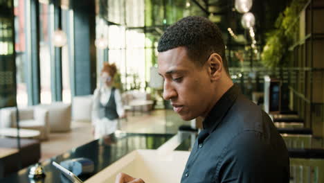 side view of african american receptionist in a hotel