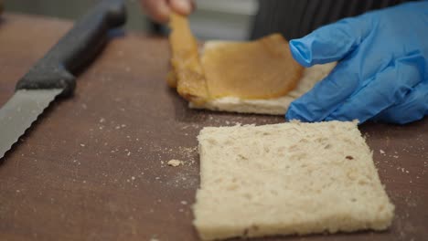 making a fruit spread sandwich