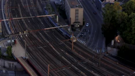 drone tracking detail shot train on tracks entering station stock hd 30p