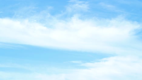 fast moving clouds time lapse at clear weather on blue sky, medium shot