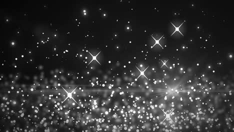 animación de múltiples manchas blancas brillantes de luz que se mueven en movimiento hipnótico sobre un fondo negro