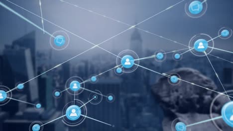 animation of network of digital icons against aerial view of cityscape