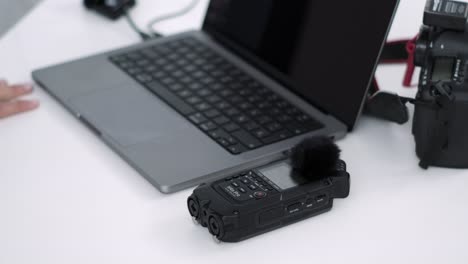 Multimedia Expert Adjusting Digital Audio Interface on Desk