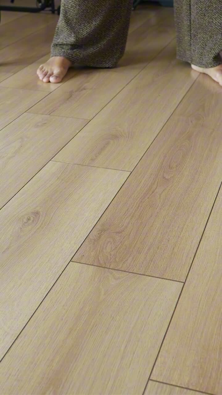 Person Mopping a Light Wooden Floor