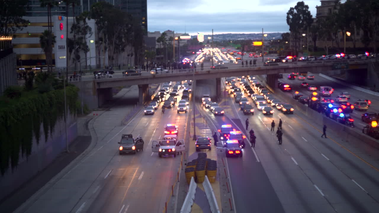 Police stop traffic on the 110 highway in Downtown due to the BLM Protests. Huge traffic jam.