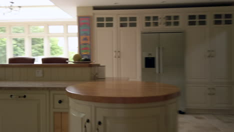 moving shot entering a rural home and revealing a large open plan kitchen