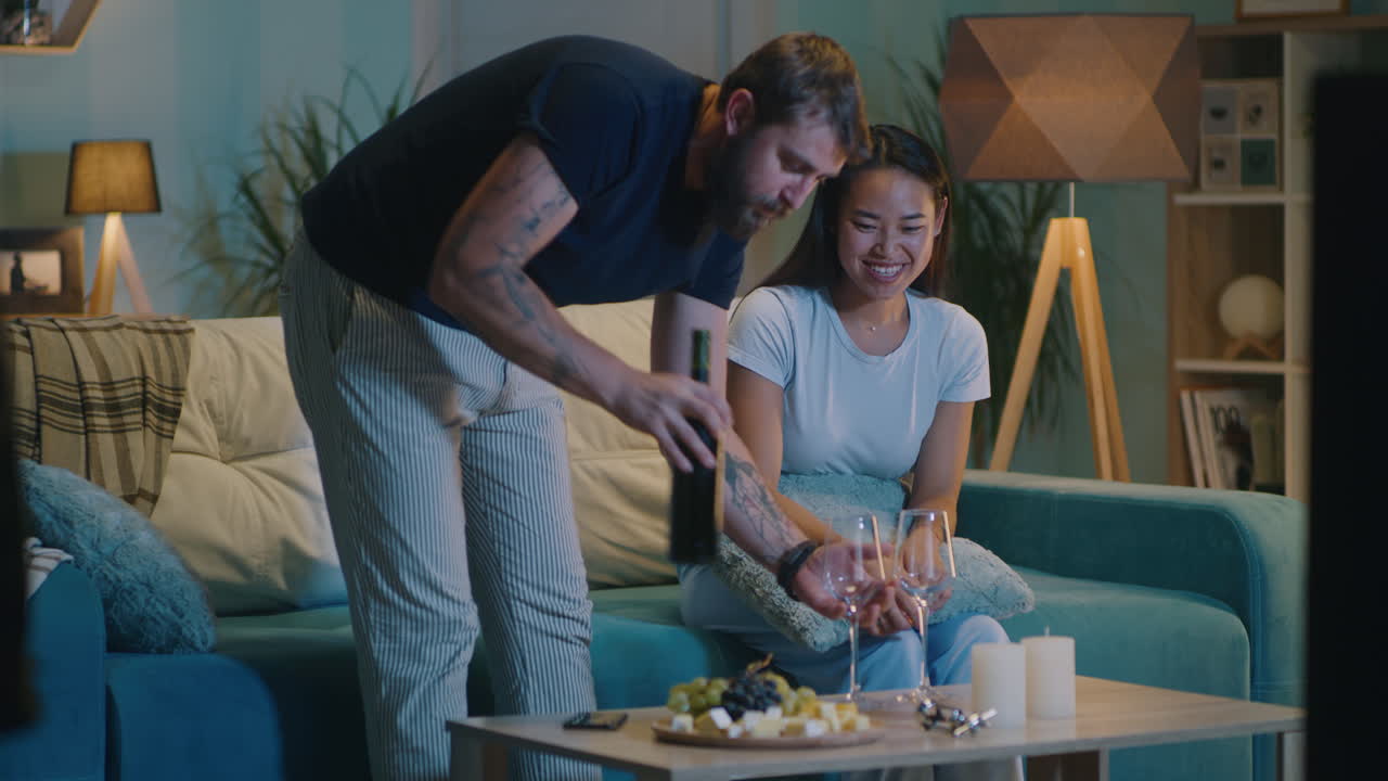 Couple Relaxing and Enjoying Wine at Home