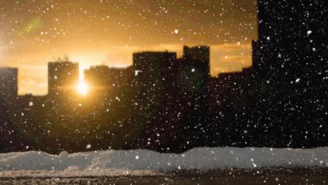 Animation-of-snow-falling-in-city-with-sunset-sky-at-christmas-time