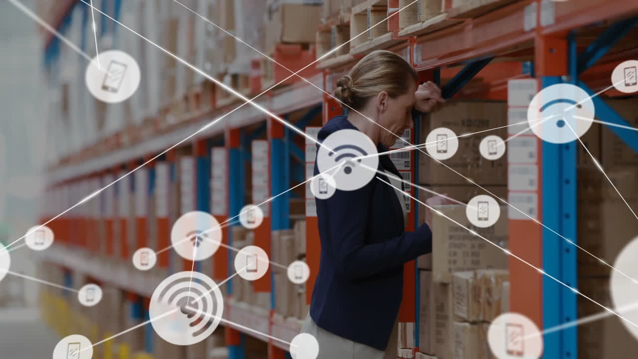 Checking inventory, warehouse worker using tablet with animation of data icons