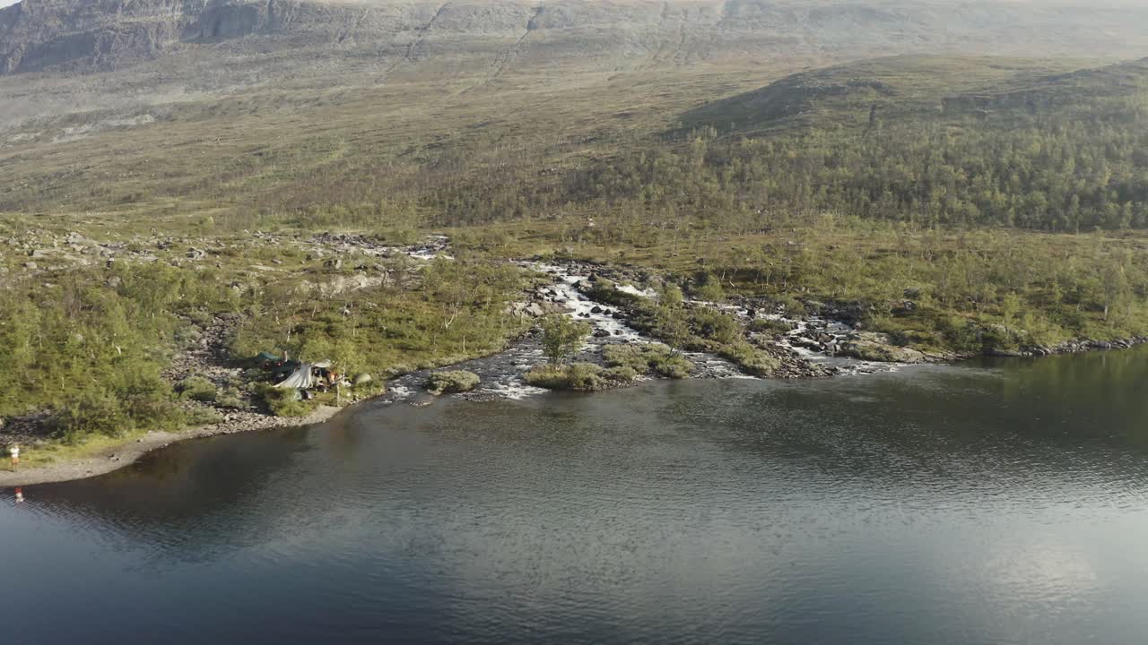 Mountain stream and lake aerial in Lapland, Sweden.