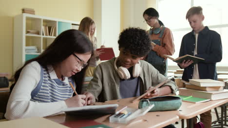 students studying and collaborating in a classroom
