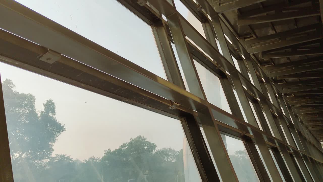 Stunning modern architecture, glass and metal framework, blending natural light and scenic views. Creative, design, and urban construction projects.