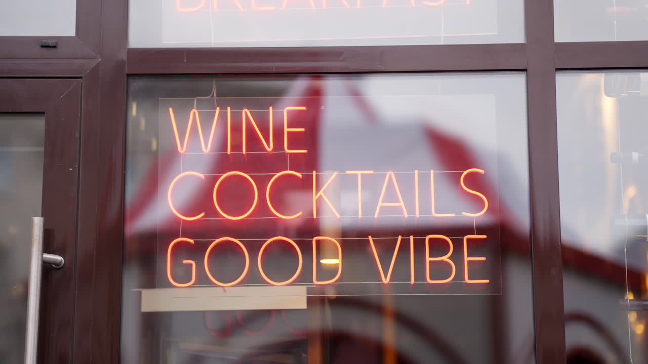 Wine Cocktails and Good Vibe Neon Sign in a Shop Window