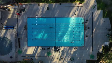 overhead topdown shot of athletic outdoor pool on a sunny day