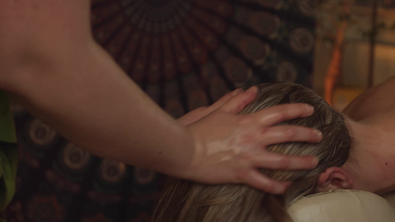 Relaxing Woman Lying On Massage Table getting head neck massage,slow motion