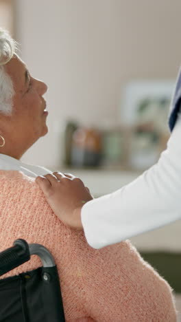 a healthcare worker provides comfort and support to an elderly woman in a wheelchair.