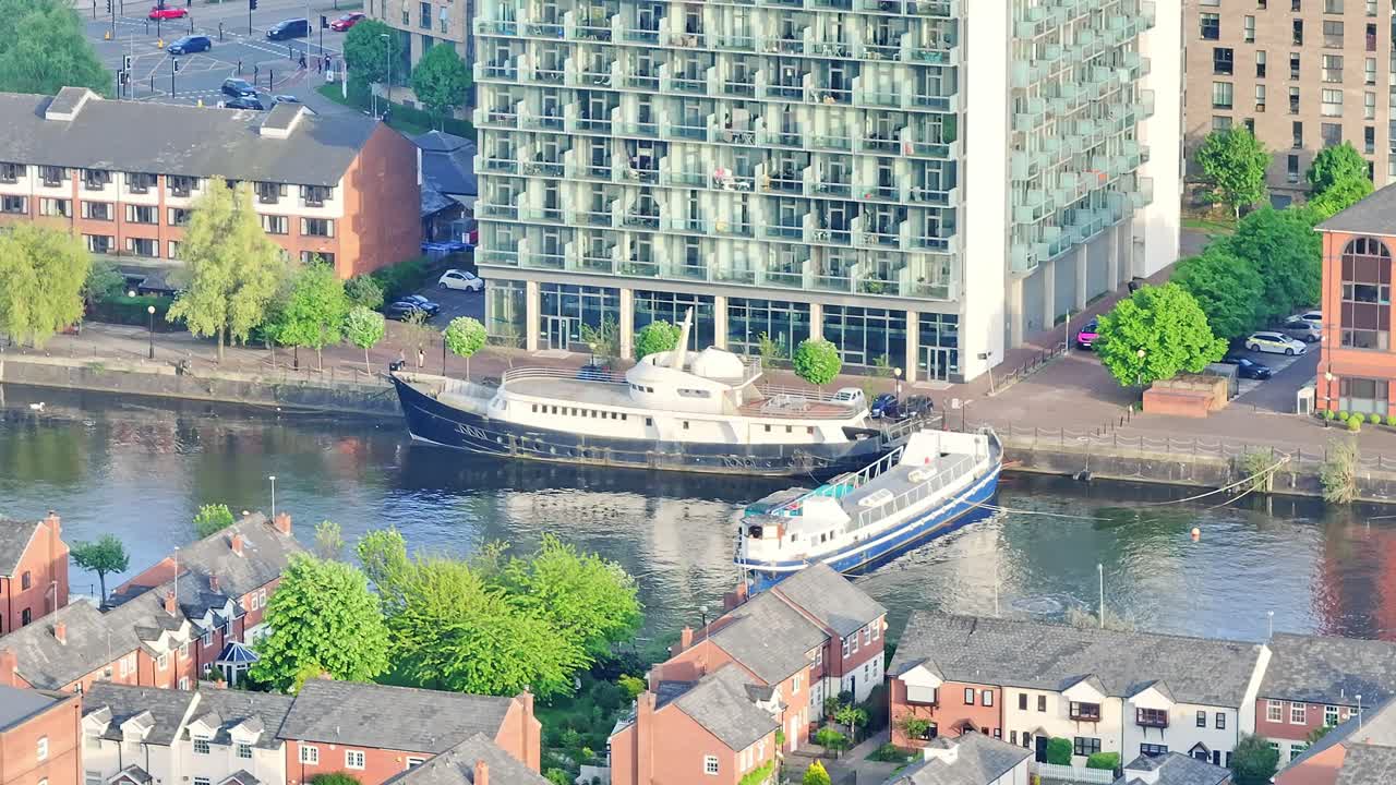 Aerial View Of Boats Anchored Along Urban Water Canal At Media City UK District, Salford Quays England