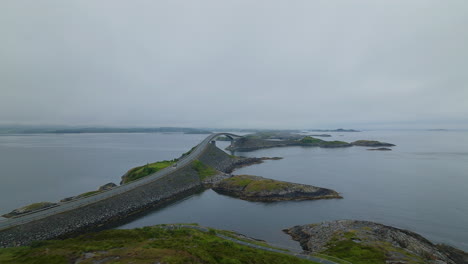 aerial towards atlantic ocean road against gloomy sky in more og romsdal county, norway